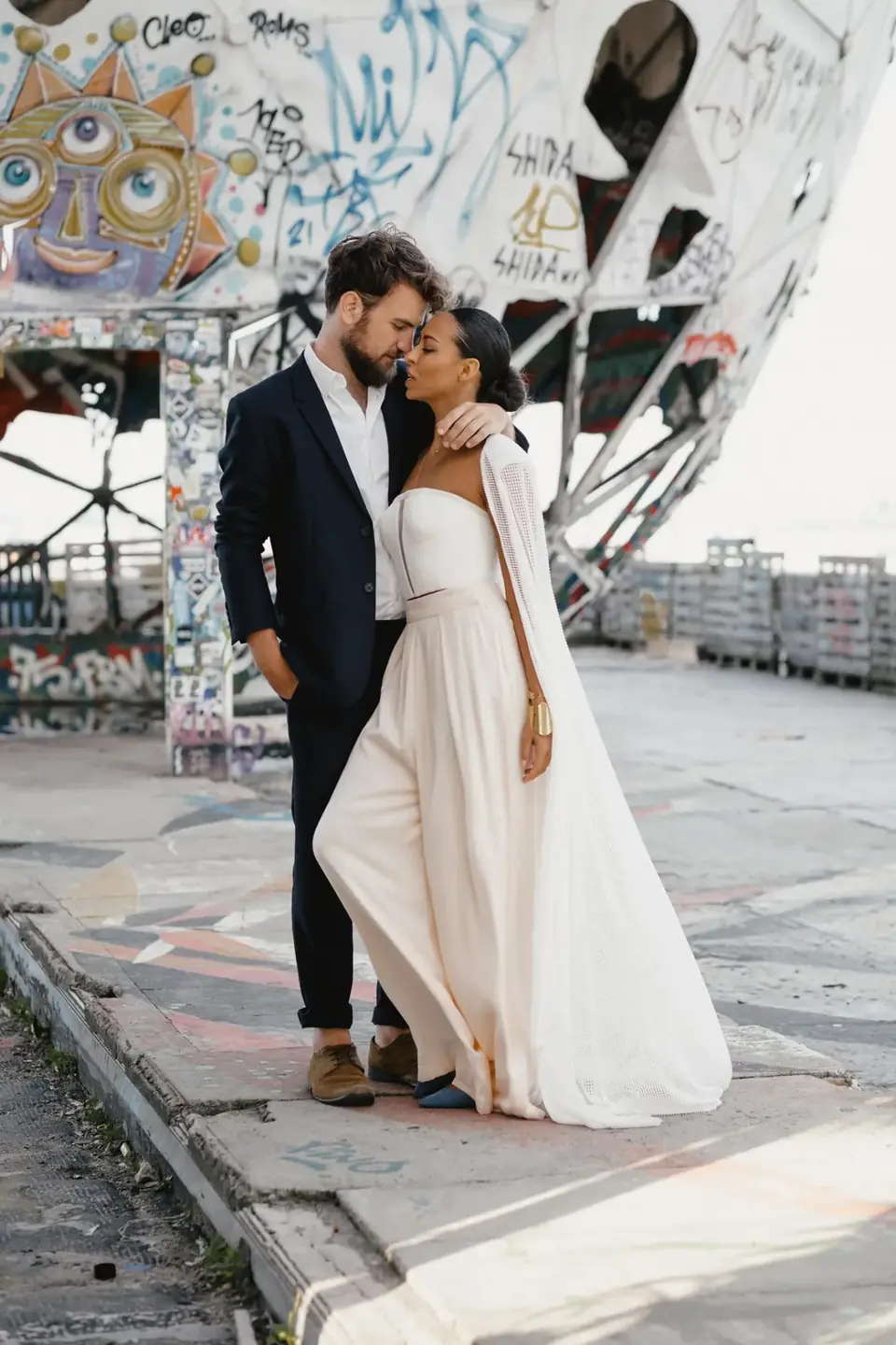 Couple embracing on a rooftop after their wedding