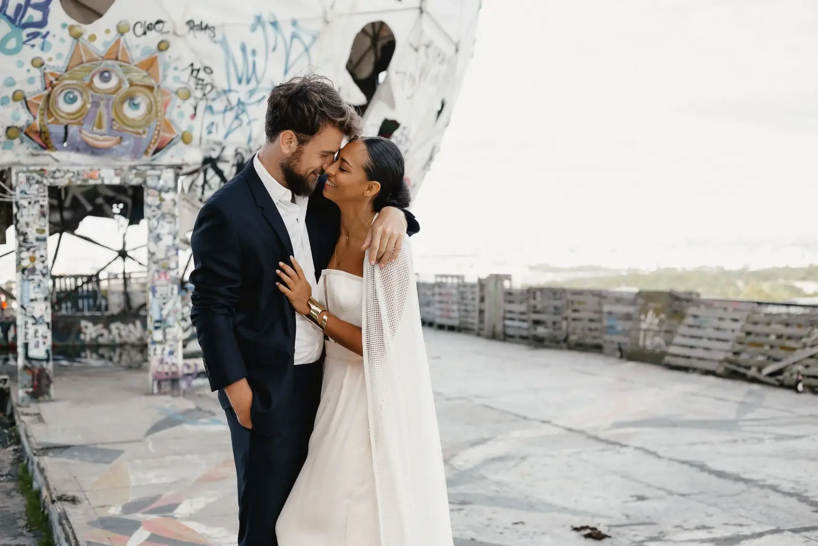 Couple embracing on a rooftop after their wedding